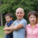 A family portrait of the Wongs, looking healthy and active, enjoying outdoor activities.